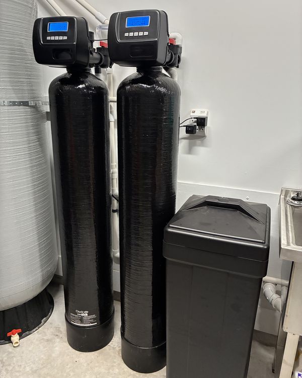Dual-tank water treatment system installed in a Northeast Florida utility room